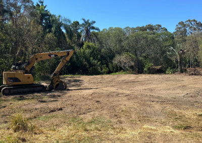 Excavator performing excavation after demolition works