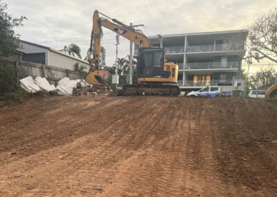 Excavator clearing a residential demolition site in Sydney